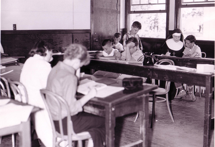 Pre-1960s classroom with students at desks